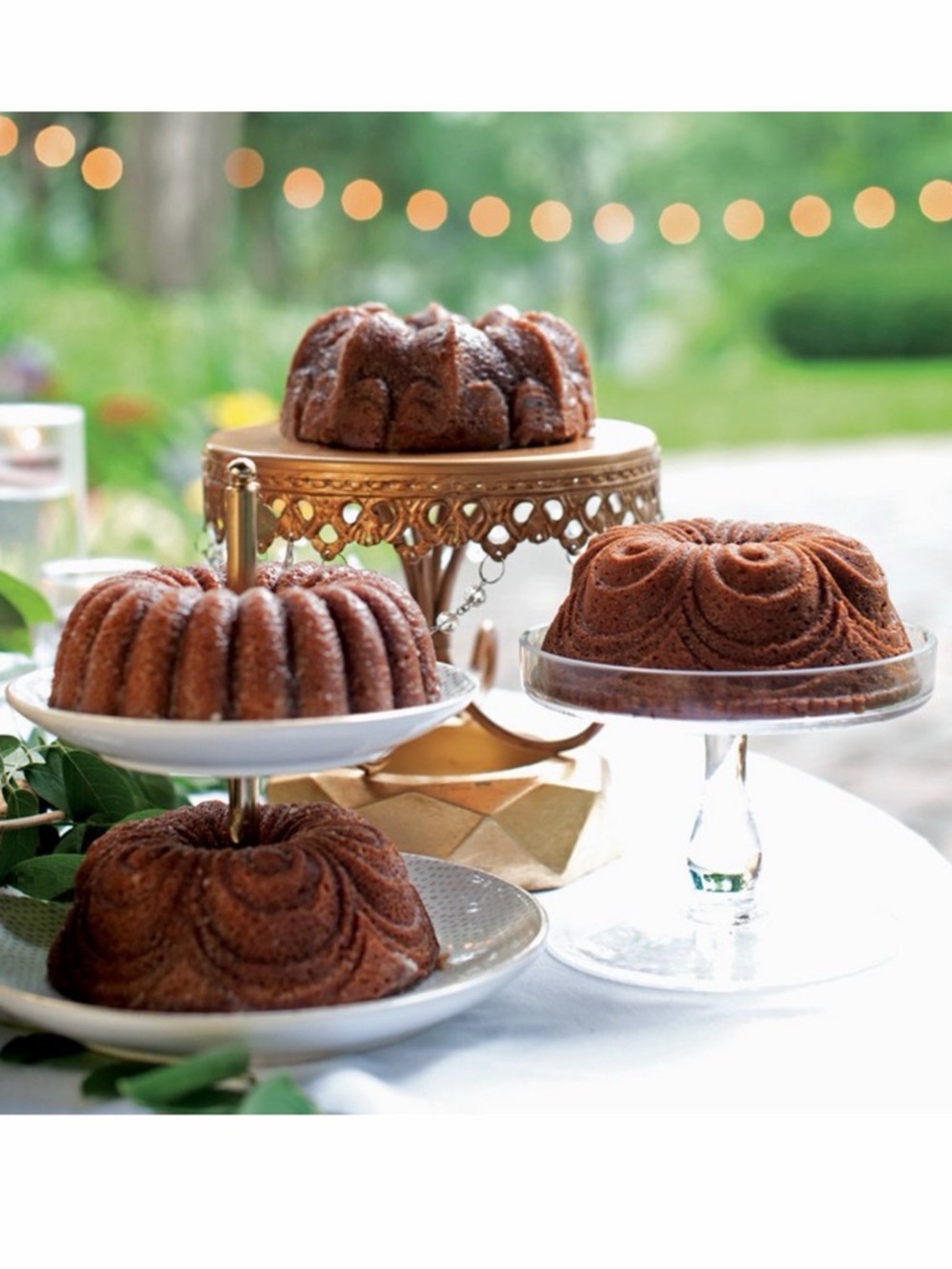 Nordic Ware Gold 9 Cup Bundt®
Quartet Pan 4 Cake Molds in 1 pan Baking Sheet - Picture 5 of 6